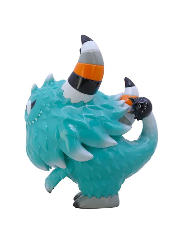 The Little Hut (HK) Rangeas Rex Jr. — Tiff: A turquoise collectible figure with two striped horns, a small black creature on its tail, and textured fur-like detail, shown in profile view.