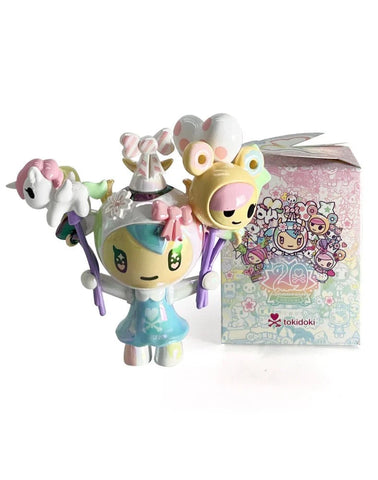 The tokidoki (IT) 20th Anniversary Blind Box features a pastel vinyl figurine with balloons and animal accessories, displayed before a matching decorated box—ideal for kawaii collectors and tokidoki fans.