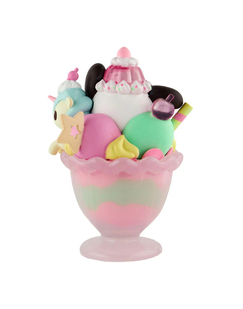 The tokidoki (IT) Tokidoki x Hello Kitty & Friends Fast Food - Pochacco Pink Unicorno Sundae (Special Edition) is a pastel dessert toy with a pink glass sundae dish, ice cream scoops, whipped cream, and candy decorations.