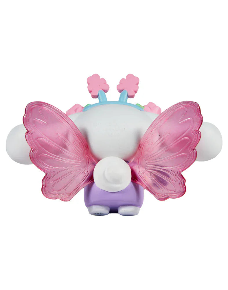 The Rotofugi Tokidoki x Hello Kitty and Friends Butterfly Garden–Cinnamoroll & Rosie Special Edition figure is shown from behind, featuring translucent pink butterfly wings, purple legs, a white tail, and blue-pink accents on its head.