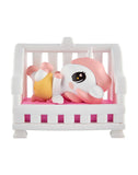 A tokidoki Baby Unicorno Blind Box figurine with a pink mane lies on its back on a white bench with a pink cushion, holding a yellow object—ideal for fans of collectible figures.