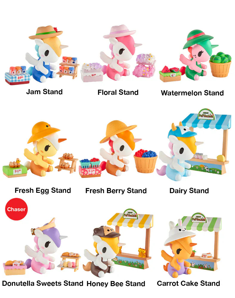 Nine tokidoki Farmers Market Unicorno Blind Box figures are displayed, each running a themed market stand—jam, floral, watermelon, egg, berry, dairy, sweets, honey bee, or carrot cake.