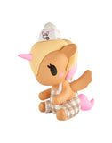 The tokidoki Farmers Market Unicorno - Cafe Cuties Coffee Bar (Special Edition) features a cute figure with pink hair, wings, and a bunny logo hat, wearing a brown checkered outfit—perfect for tokidoki and Cafe Cuties collectors.