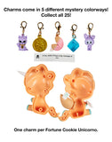 Five clip-on charms and a fortune slip are shown above an opened orange Tokidoki Fortune Cookie Unicorno Blind Box. Text notes each box includes one surprise figure for added fun and collectability.