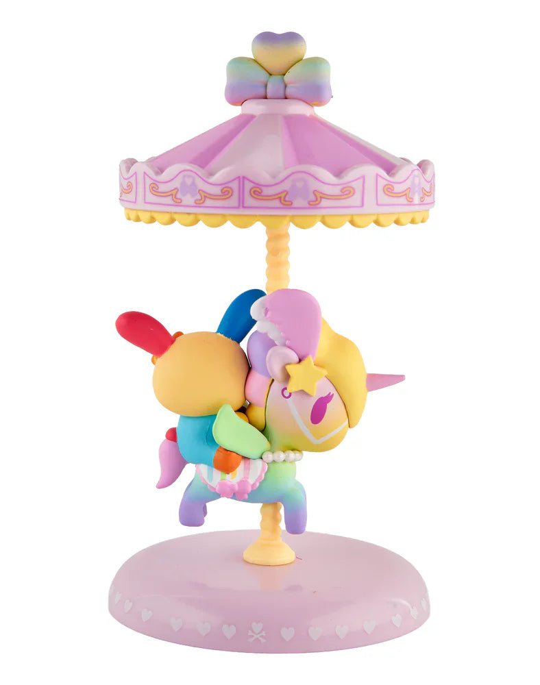The tokidoki x Hello Kitty and Friends Sweet Pink Carousel - U*SA*HA*NA (Special Edition) figurine features pastel colors, a round base, and a decorative canopy—an adorable collectible for any tokidoki fan.