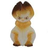 A glass figurine called Yogira — Milk Tea from Fewmany (JP) showcases a stylized cat with large ears and an abstract brown and cream design, reminiscent of Yoyo Yeung's artistry.