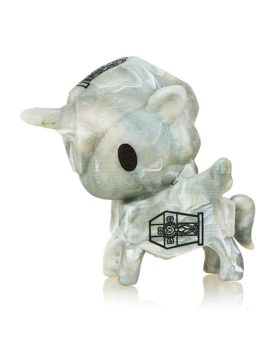 Introducing the Tokidoki Unicorno After Dark S5 Little Zombie Limited Edition, a marble-patterned figurine featuring large black eyes and a short tail. This special edition unicorn, adorned with a unique black door design on its side, is perfect for collectors.