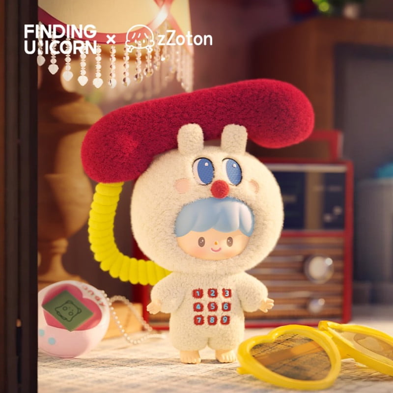The zZoton — Happy Childhood Blind Box by Finding Unicorn features a blue-haired figure in a fluffy white suit with a red phone receiver hat, standing beside nostalgic items like a pink Tamagotchi, yellow glasses, and a vintage radio.
