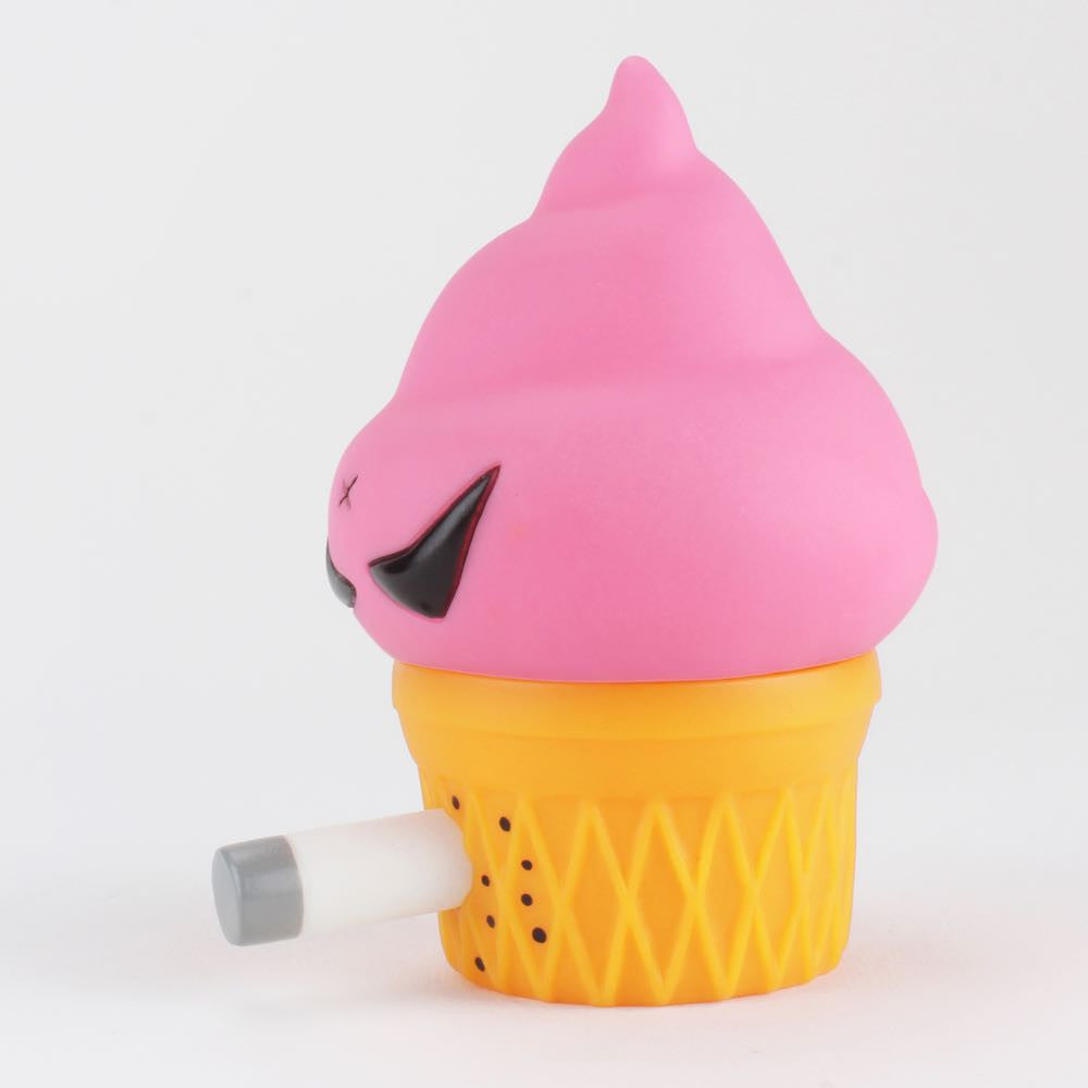 The Smorkin' Monger Jerome - Strawberry by Squibbles Ink + Rotofugi (US) resembles a pink ice cream cone with a cigarette, black eyes, and a yellow base, designed by Frank Kozik.