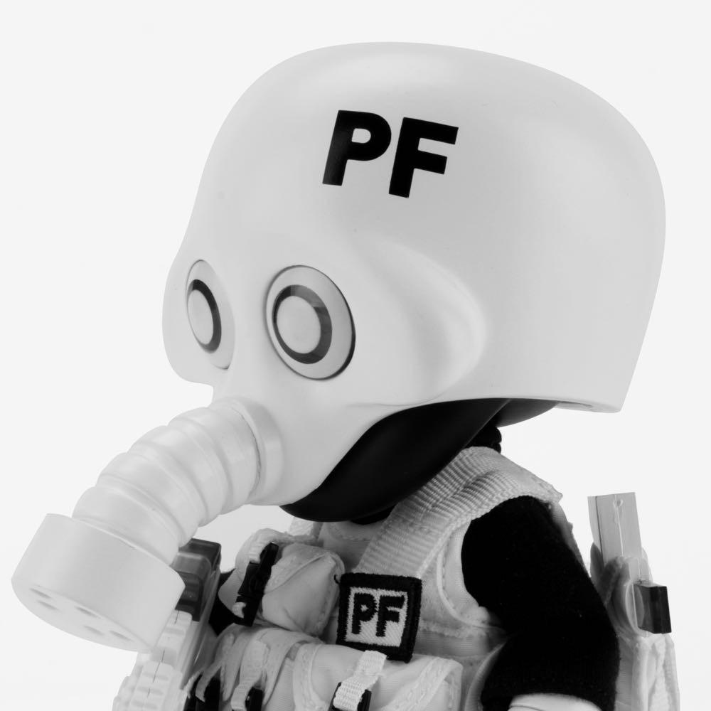 A stylized figure resembling the Squadt NOZZEL S005 [PEACE F***ER] by Playge (HK/US) wears a white 