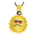A yellow necklace with a Sad Sun eeensy Charms - Blind Box charm by Squibbles Ink + Rotofugi.