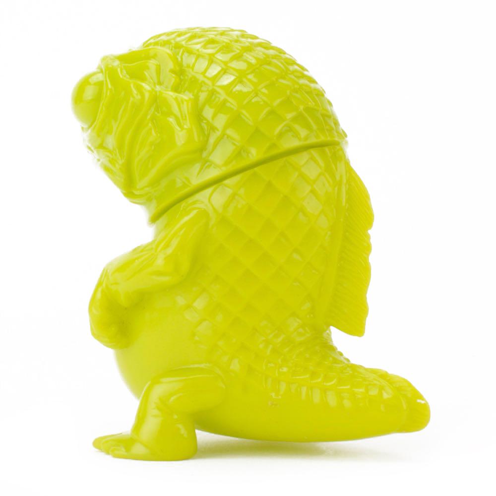 A green Snybora - Unpainted/DIY toy fish sculpted on a white background by Squibbles Ink + Rotofugi (US).