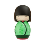 The Soul Momiji Doll - Green by Momiji (UK) is a delightful small wooden figure with a round head and simple facial features. Dressed in an elegant green kimono adorned with black and green patterns, this charming doll conceals a secret message, making it an intriguing addition to any collection.