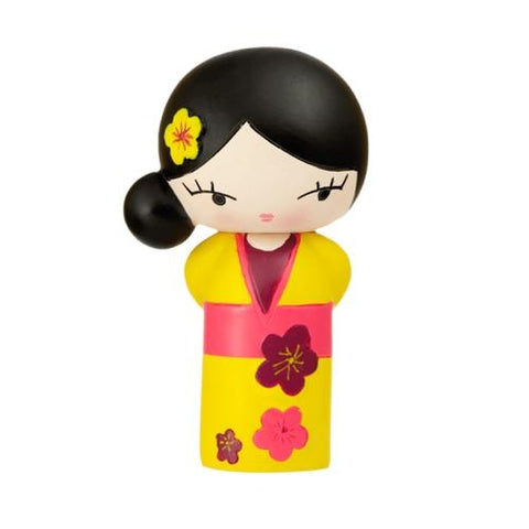 The Birthday Girl Momiji Doll by Momiji (UK) features a small, handpainted resin design with a yellow kimono adorned with pink flowers. Its black hair is styled in a bun, complete with a flower hair accessory. This charming figurine is perfect for spreading love and conceals a secret message within its delightful form.