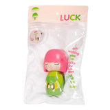 The Lucky Momiji Doll by Momiji (UK) is a handpainted resin figurine featuring pink hair and dressed in green, packaged in a clear plastic bag with the 