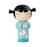 Introducing the Best Friends Momiji Doll by Momiji (UK), a beautifully handpainted wooden doll featuring black hair styled in pigtails. Dressed in a light blue outfit with two charming white birds, the doll's closed eyes and folded hands hide a secret message within.