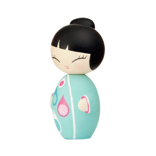 A classic Little Star Momiji Doll from Momiji (UK), this wooden figure features black hair and closed eyes, clad in a turquoise dress adorned with pink and blue circles. When viewed from the side, it holds the charm of a hidden message waiting to be uncovered.