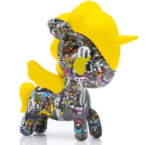 A yellow Manga Mania Unicorno Blind Box toy with a lot of different designs inspired by Japanese comics from the brand tokidoki.