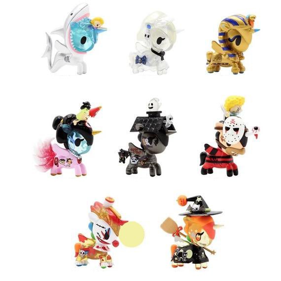 A set of small Unicorno After Dark Series 2 Blind Box figurines in various outfits from the tokidoki collection.