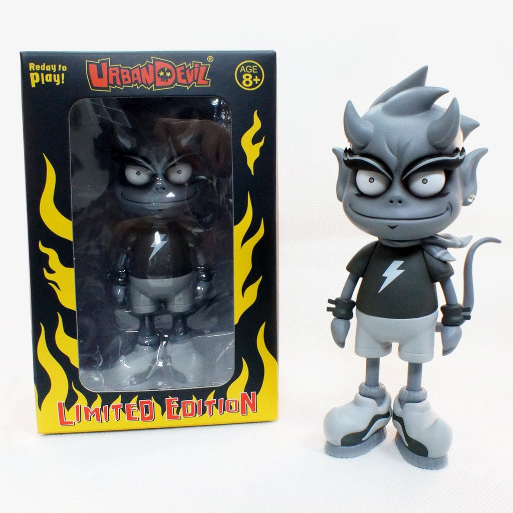 A Urban Devil figure created by Urban Devil (TW) stands in front of a box.
