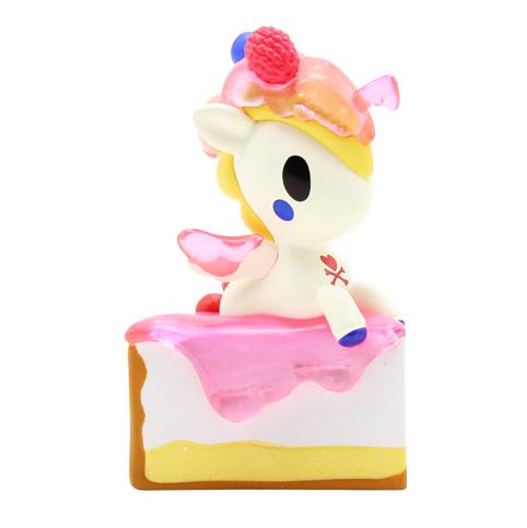 A Delicious Unicorno Blind Box from tokidoki is perched atop a dessert-themed cake.