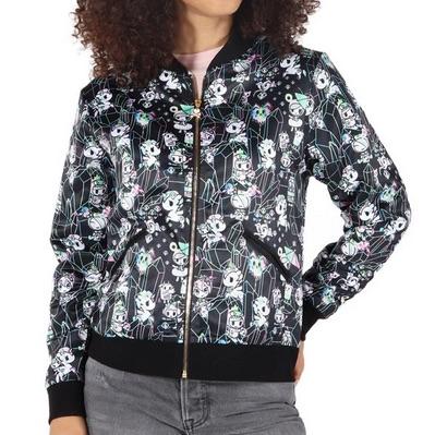 A woman wearing a Tokidoki Crystal Palace satin bomber jacket with an all-over print of skulls.