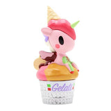 A Delicious Unicorno Blind Box figurine featuring a pink Unicorno perched atop an ice cream cone by tokidoki.