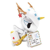 A figurine of a unicorn holding a letter from the tokidoki Holiday Unicorno Series 3 Blind Box.