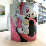 A ceramic mug with a cartoon character artwork by Rotofugi's Gary Baseman Playboy Redux Mug.