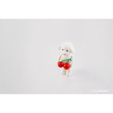 A Puppy Tang F2 resin figure holding cherries on a white background by AICHIAILE.