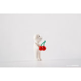 A Puppy Tang F2 resin figure holding a cherry on a white background, limited edition by AICHIAILE (CN).