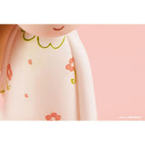 A Queency resin figure of a little girl in a pink dress by AICHIAILE.