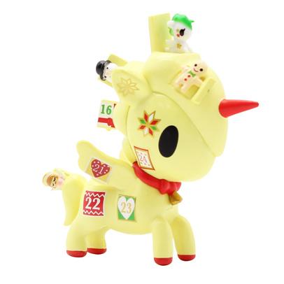 A Holiday Unicorno Series 3 Blind Box toy with a Christmas ornament on its head from tokidoki.