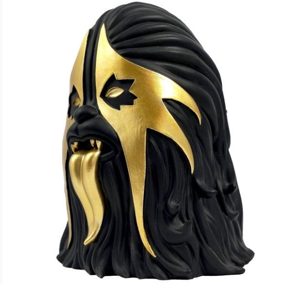 A limited edition MintyFresh (NL) Thrashbacca - 4 inch Black and Gold Edition statue of a black and gold mask.