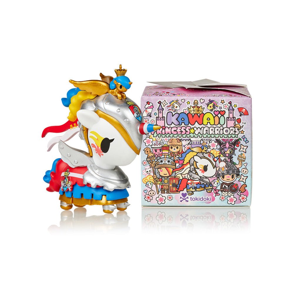 A small Kawaii Princess Warriors Blind Box with a crown on it next to another blind box.