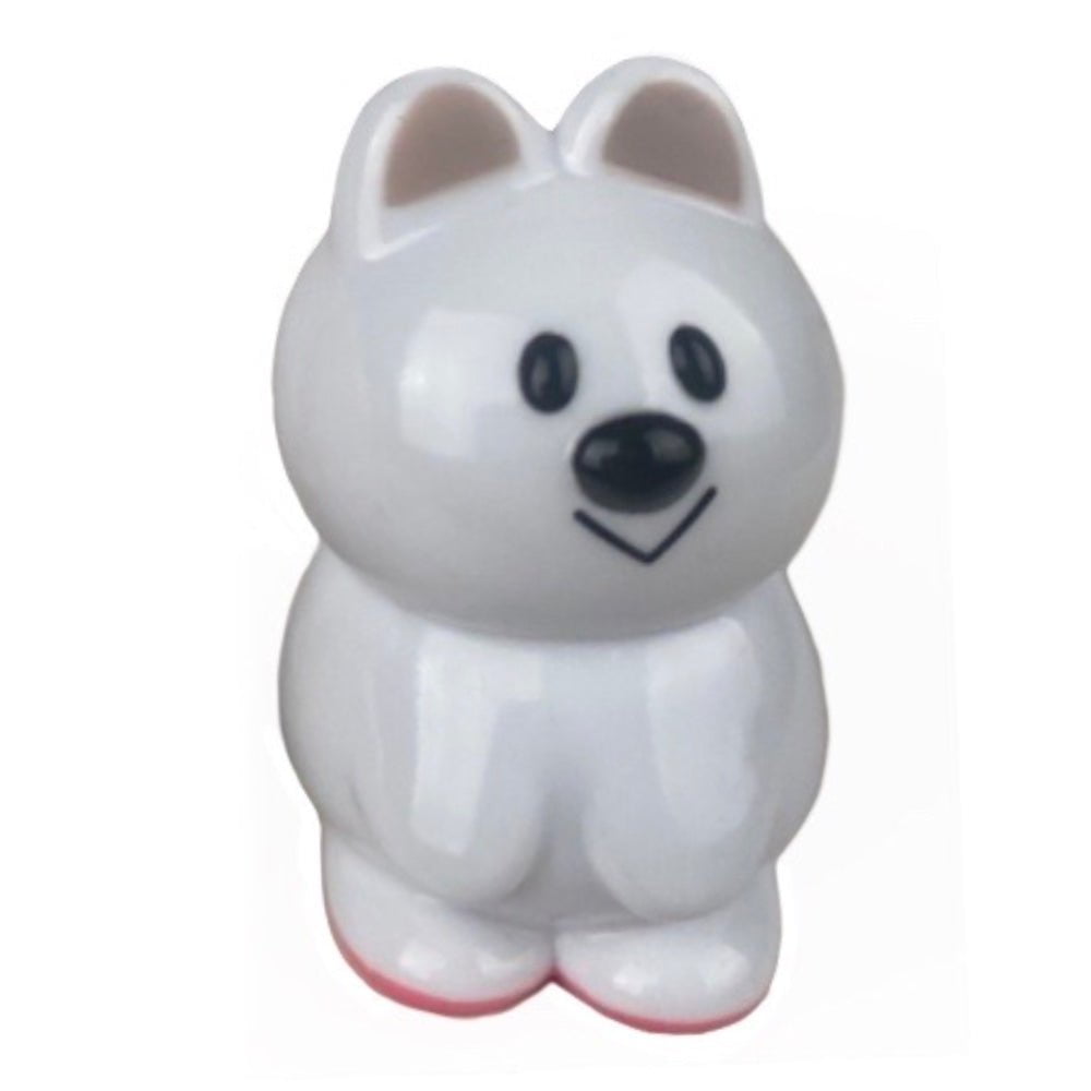 A white ceramic figurine of a polar bear sitting on a surface, VAG 33 - Kuokka Chan by Medicom (JP).