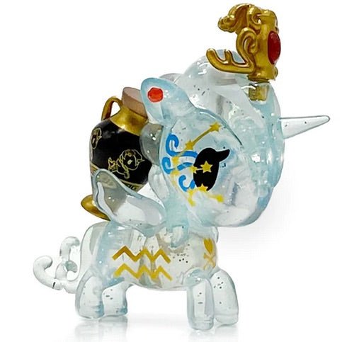 A small figure of a unicorn with a crown, inspired by the Zodiac Unicorno — Aquarius from tokidoki.