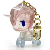 A Celeste Unicorno bag charm by tokidoki with a gold chain.