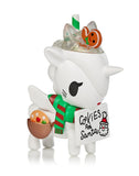 The Unicorno Holiday Series 4 Blind Box, wearing a santa hat, is holding a sign.