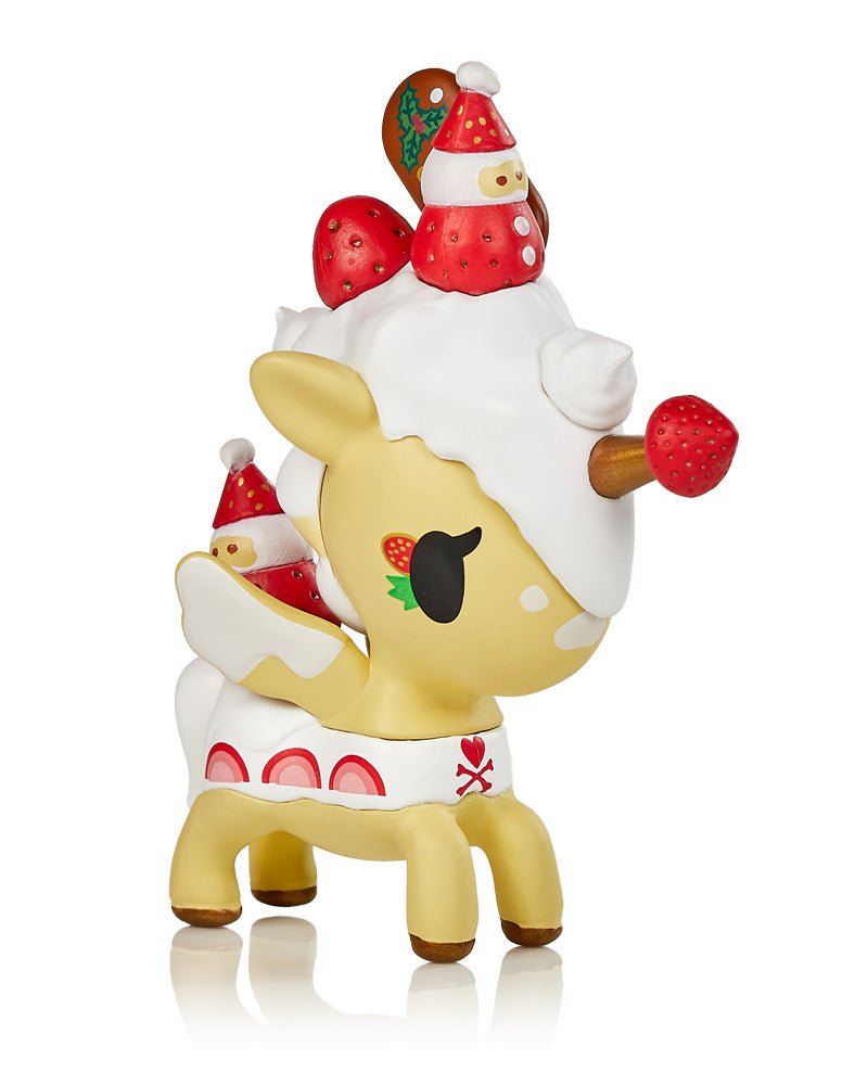 A tokidoki Unicorno Holiday Series 4 Blind Box toy reindeer with a santa hat on its head.