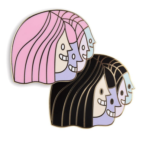 A collection of enamel pins showcasing various hairstyles from The Artpin Collection - Junction.