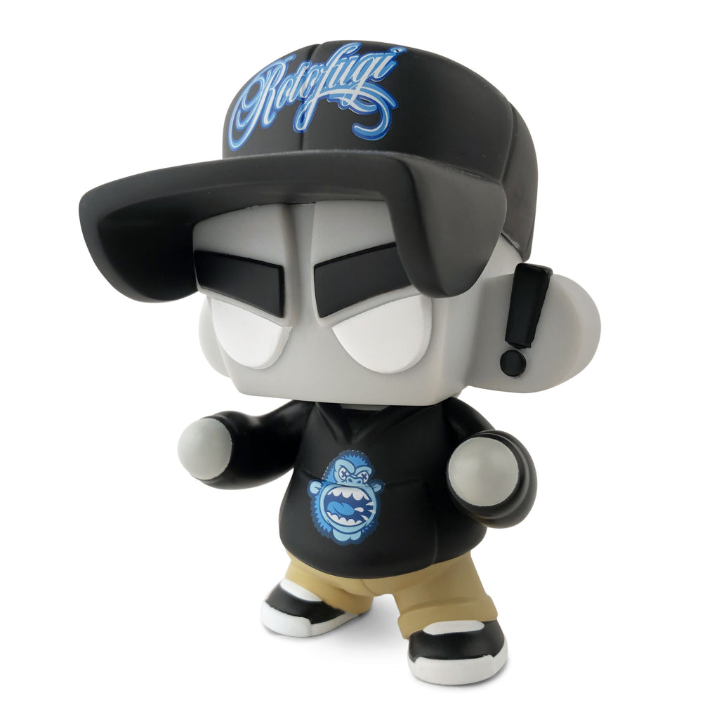 A figure wearing a unique hat and baseball cap, designed by UVD Toys featuring the Mad*L Citizen — Rotofugi Mad Ape.