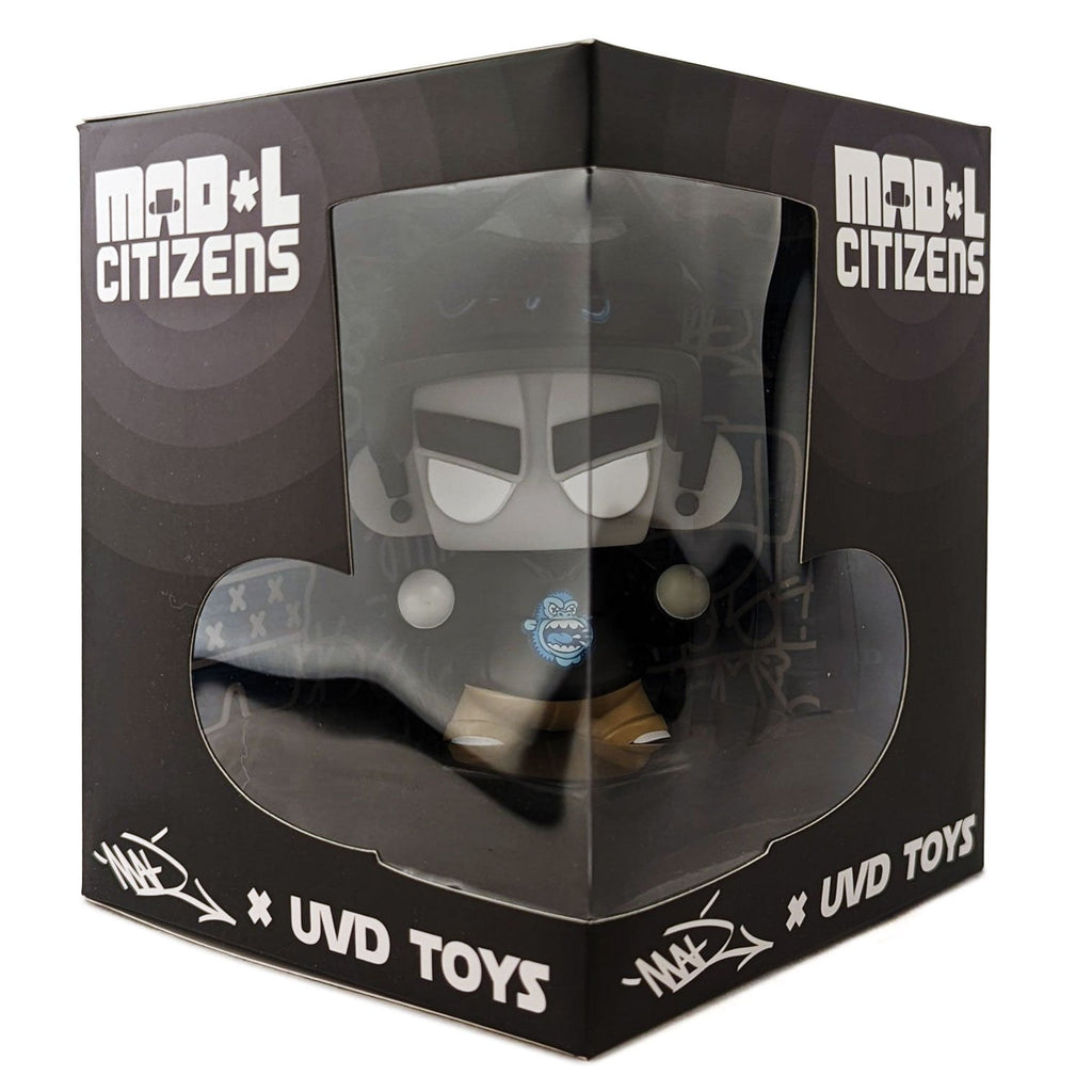 A Mad*L Citizen toy in a box with a black hat, created by UVD Toys.