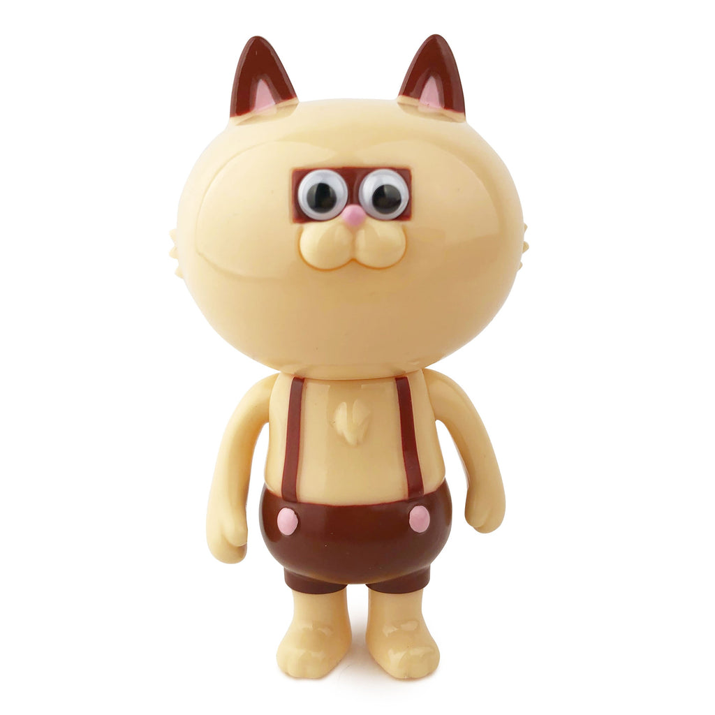 A Nekotaro — Caramel toy cat stands on a white background.