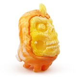A toy with an orange head reminiscent of a Skully Ghost — Candy Corn by Squibbles Ink (US).