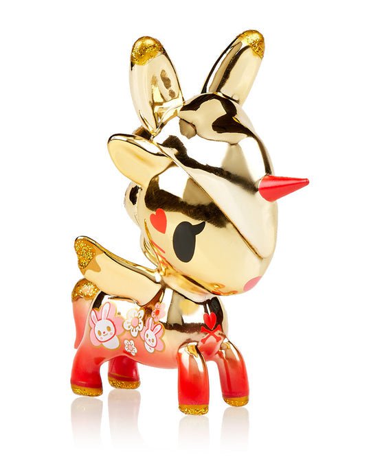 A limited edition gold figurine of a deer with a red nose: Unicorno — Lunar Calendar Metallico Year of the Rabbit Limited Version by tokidoki.